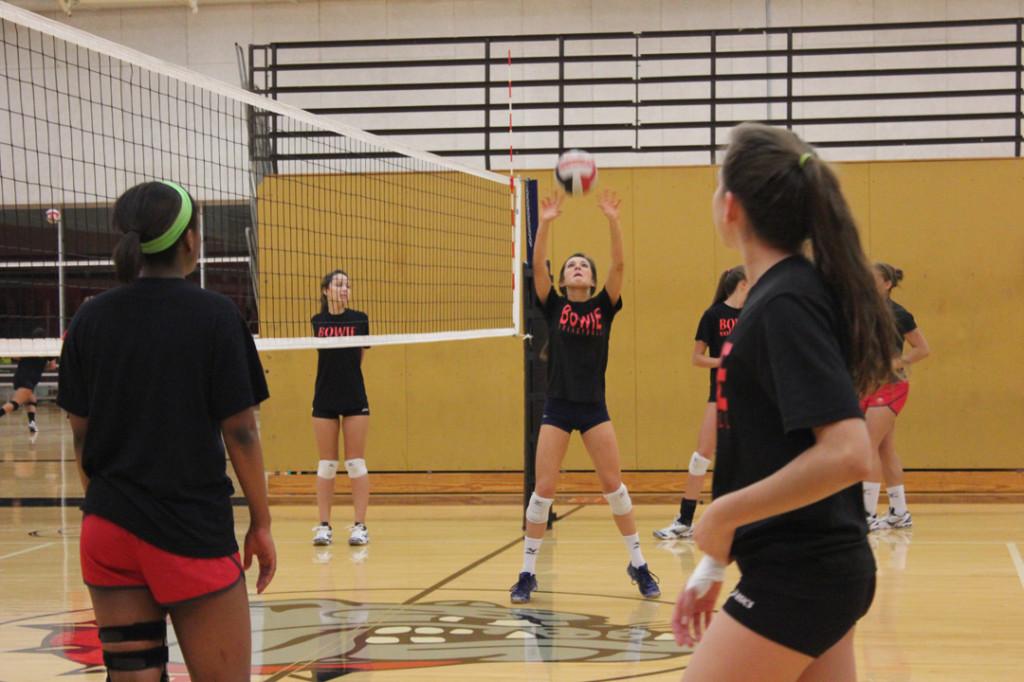 Sophomore Shelby Johnson sets the ball over the net during practice. The Lady Dawgs train for their second round of games.