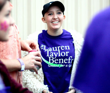 Lauren smiles as she enjoys the company of her friends. Friends and family gathered at the Painted Horse Pavilion in Buda, Texas for an event in hopes of raising money for the Taylor family.