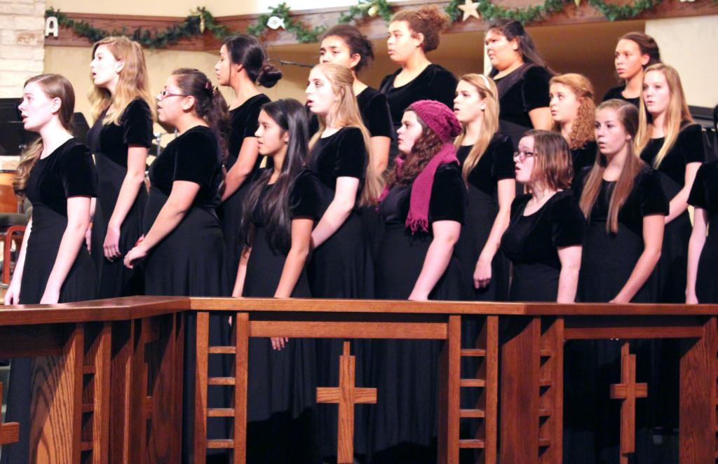 Choir+gets+into+place+for+the+26th+annual+winter+choir+concert.+Just+moments+before+choir+was+preparing+in+the+choir+room+running+through+their+songs+and+learning+their+positions+in+the+show.+%E2%80%9CThroughout+the+year+the+winter+concert+is+always+the+best%2C%E2%80%9D+Hyde+said.