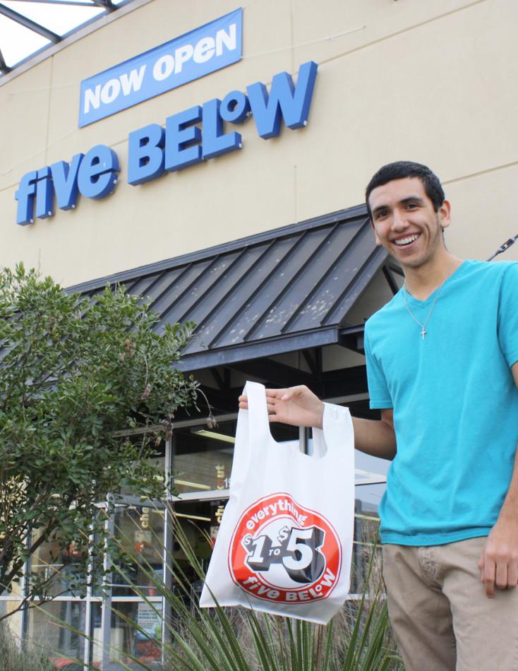 Senior Jason Galarza racks up on t-shirts and phone accessories at Five Below in Sunset Valley. Even with five items, his total was still under $19.