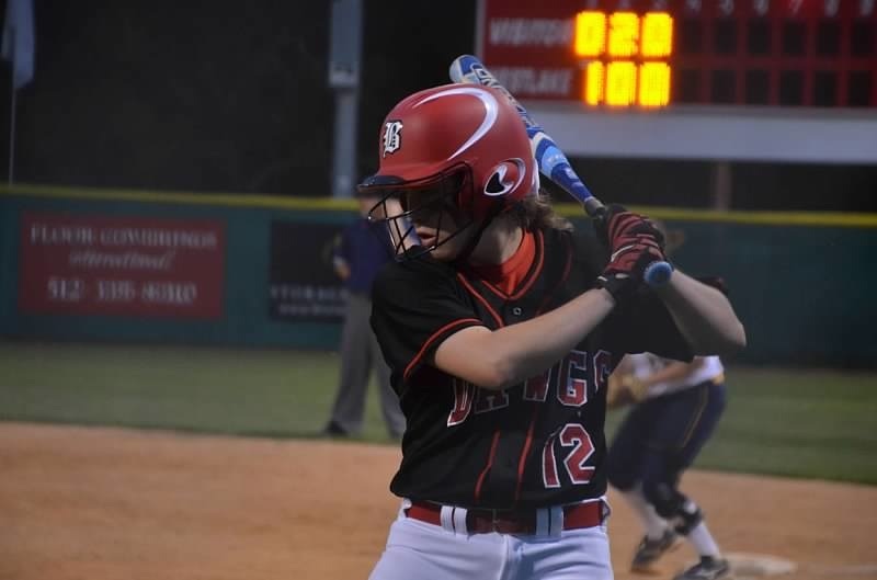 Junior Ashli Lotz prepares to hit the ball in a game against Stony Point in the Bi-district playoffs. The team went on to win the game with a 4-1 score.