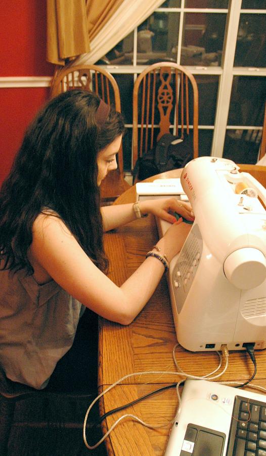 Sewing for the future: O’Leary hard at work on her sewing machine, making her customers some of her monogrammed products. O’Leary practiced every day on her machine when she first got it  Photo courtesy of James O’Leary