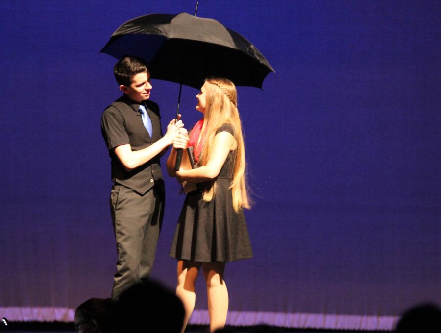 What a glorious feeling: Juniors DJ Fortner and Jenny Harms show off their hard work while Fortner performs “Singing in the Rain”  to preach love to the world. This scene was crucial to the play as a whole because it leads to the key conflict. Photo courtesy of Robin Hyde-Maksimchuk