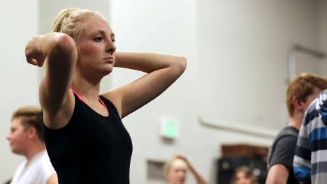 Junior Chloe Byars pushes her hair away from her face at ZACH theatre auditions. Throughout the year, all performers practiced vigorously for the fine arts program in different events. 