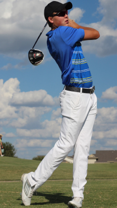 Dawson Zabloski watches as his golf ball files across the bright green field. Zabloski had just finished swinging the ball at a range that he had a very hard time perfecting