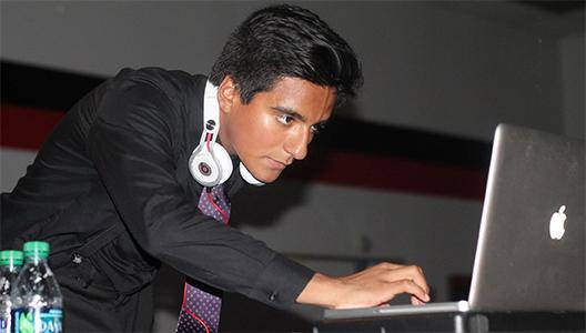 Staring at his computer as he prepares the next song, senior Miguel Lozano Dj’s the homecoming dance. Lozano took student requests from Twitter. “It was a great experience and definitely an unforgettable night,” Lozano said. 
