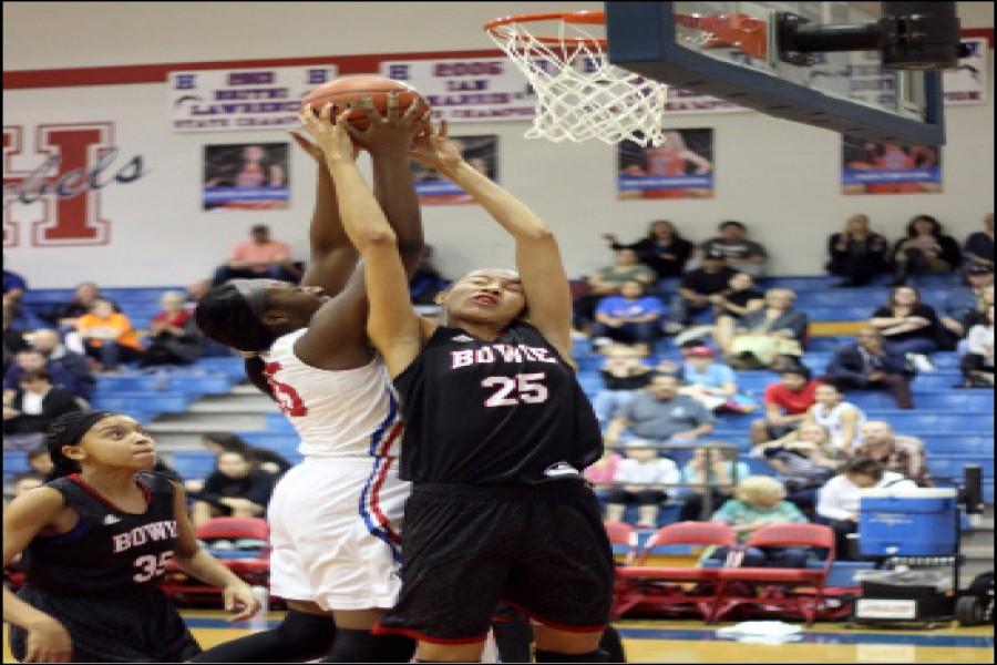Senior Kianna Ray guards number 35 closely as she tries to make the shot. Ray is quick to block the ball from going in. The lady dawgs were up against the Hays Rebels, losing by 12 points for the second time with a score of 54-44. 