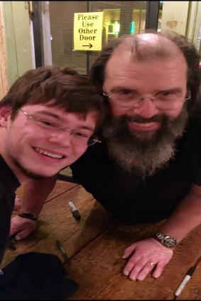 Kenny Finkelstine poses with singer-songwriter Steve Earle for a selfie on his iPhone. Earle is one of his favorite artists and has inspired him musically. 