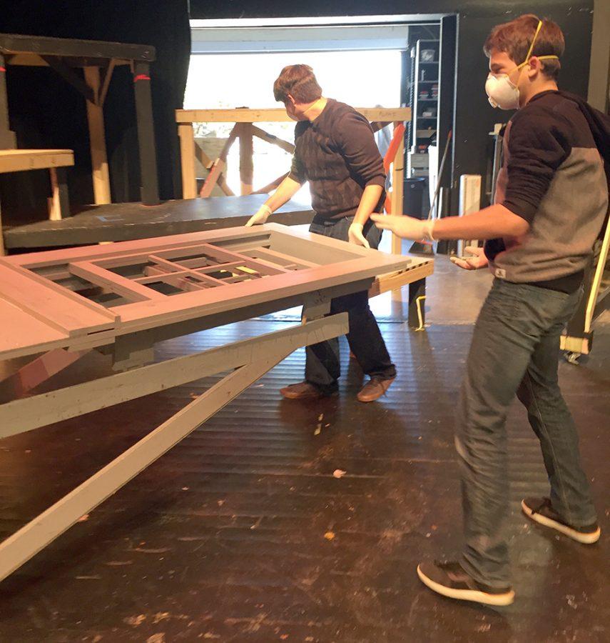 Sophomore+Tanner+Howell+and+Luke+Fisher+help+move+a+moldy+set+piece+out+of+the+theatre.+Due+to+heavy+rainfall+and+flooding+the+theatre+started+to+grow+mold+in+certain+areas.+