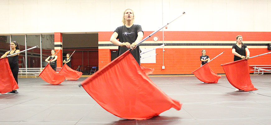 SPINNING THROUGH PRACTICE: Caption Shannon Ross practices with the team after school. Ross and the team are preparing for Winter Guard and perfecting their routine. Practice is from 6:30-9:30 pm on Wednesday and Thursday night.   