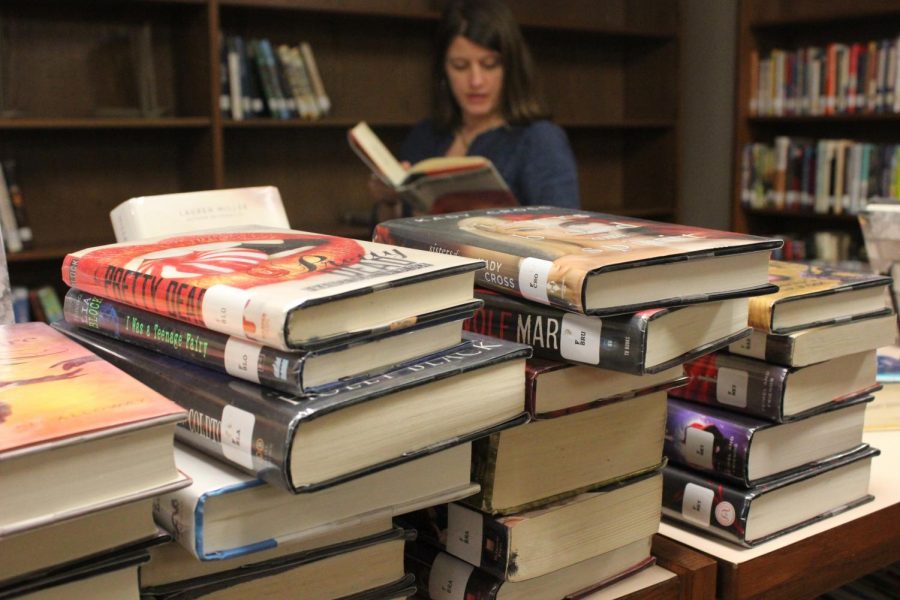 FINES CUT: Bowies new librarian Steffanie Persyn arranged books to organize and update their catalog. There are no longer fines in the library and no limit for checking out books. Extended after school hours in the library are being considered, so keep an eye out.