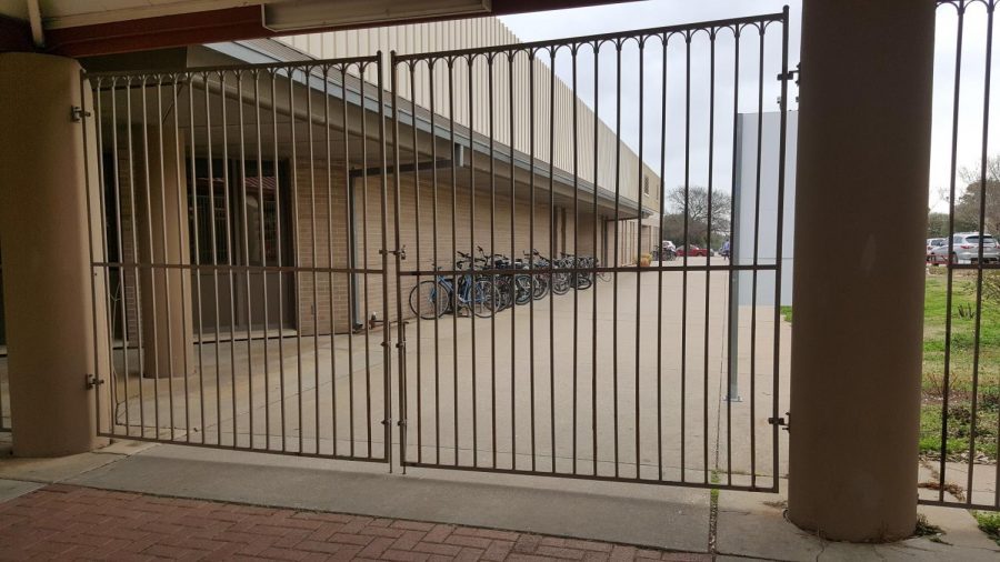 NECESSARY PRECAUTIONS: Following the events of the Stoneman shooting, Bowie has reinforced their security by locking gates and doors around campus, including the gate to the left of the main office, pictured above.