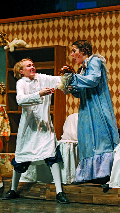SPOONFUL OF SUGAR:  Freshman Riley McCue and senior Emily Robinett play Michael and Jane Banks. The actors energy captivated their viewers.