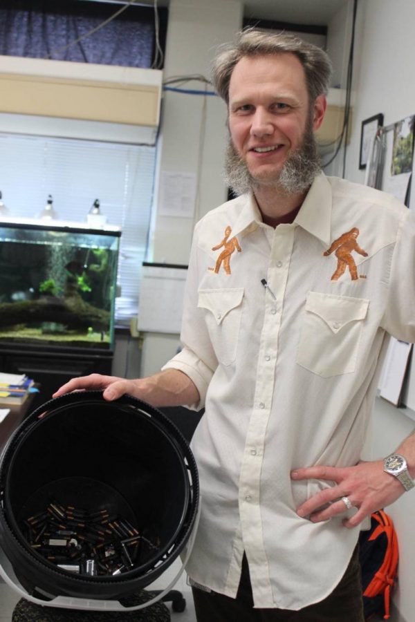 Pictured above is science teacher Aaron Bryant holding up the current collection of batteries that the program has in use.