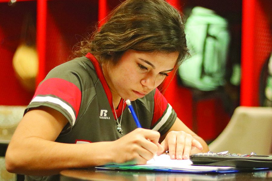 Senior Tiffany Licon does her math homework, using her time while she has it. Tiffany is a softball player and is one of many student athletes who has to miss school often because of games and tournaments.