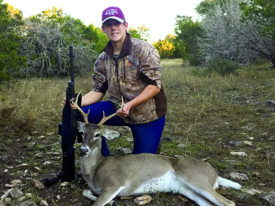 BIG+BUCKS%3A+Sophomore+Dalton+Robertson+holds+up+a+deer+by+its+antlers.+His+family+gutted+it+and+took+the+meat+of+the+deer+to+be+processed.+PHOTO+COURTESY+OF+Dalton+Robertson
