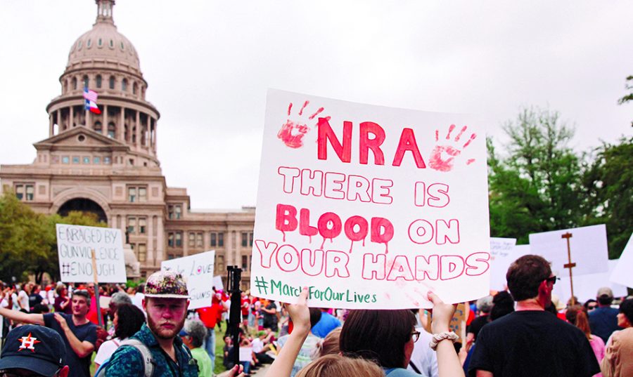 MARCH+FOR+OUR+LIVES%3A+Bowie+junior+Charlotte+Seitz+marches+on+the+Austin+capitol+carrying+a+sign+calling+out+the+NRA+for+their+role+in+firearm+accessibility.+March+for+our+Lives+occurred+nation-wide+on+March+24+to+invoke+federal+policy.+