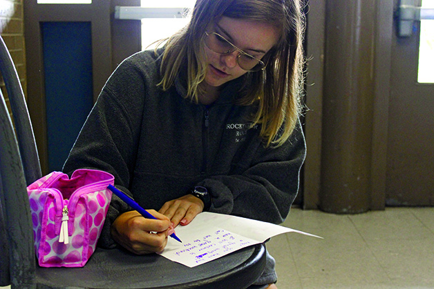 FOCUSING ON KINDNESS:  Alyssa Poole makes a card for her buddy, these cards are used by the members of Bowie Buddies to show kindness to their buddies and to check in with them from week to week.  Along with letters, they also have face painting and celebrations on spirit days. 