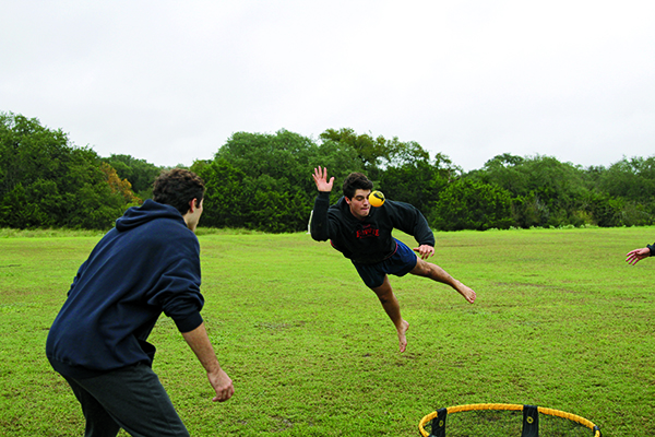 AIRBORNE: Mid-dive, junior Trey Campsmith, jumps and saves the point despite the muddy and wet field. Campsmith originally got involved with Spikeball because of his sister. “My sister got a Spikeball net for her birthday last November, but nobody really knew what it was so it just kinda sat in my garage,” Campsmith said. ”In January I saw a video on Instagram of people playing and it looked really cool, so I started to get my friends into it.”