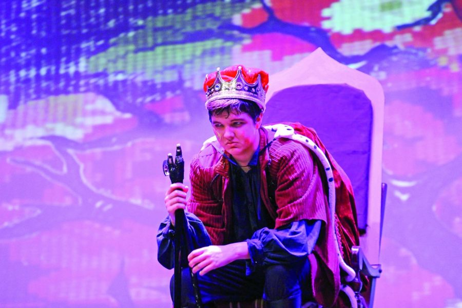 Gloucester glares at his subjects: Senior Ben Harmon, acting as Gloucester, sits in his throne after he has become king. Harmon sets the scene of his rise to power and newfound authority with an angry glance at his fellow castmates who are approaching him. Harmon continually radiates an aggressive attitude to get into character. 