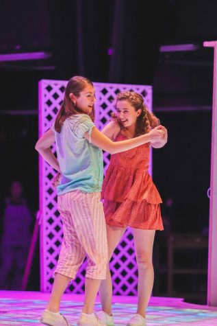 Kaia Pierce (left) and Maya Gerdes (right) show off their costumes as they perform Mamma Mia 