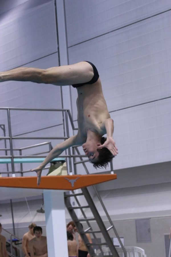 LOOKING UP: Alekzandr Popper executes a back flip off of the 1 meter board. He placed first with 488 points at districts. 