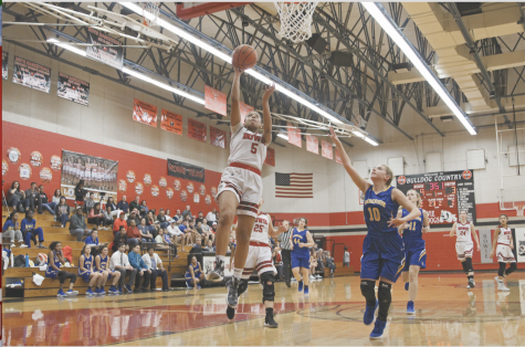 Senior guard assists varsity to victories