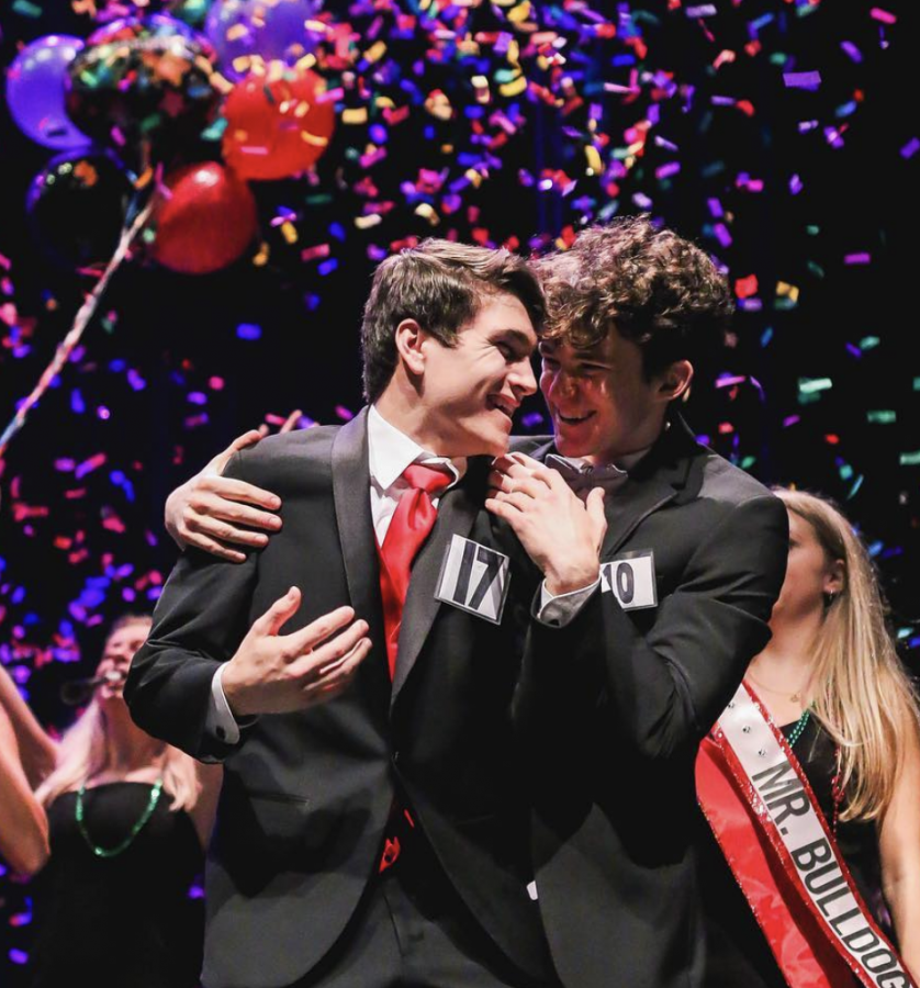 SHOCKED: Senior Stephen Achilles is congratulated by fellow contestant senior Harrison Louis after winning Bowies annual Mr. Bulldog competition. 