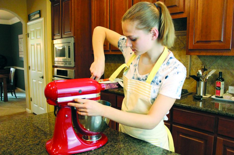 THE WAY THE COOKIE CRUMBLES: Sophomore Mariah Barsotti prepares cookie batter for her baking busi- ness: Mariah Makes. Barsotti’s business has been running since Valentines Day of 2018, and she primarily sells to her peers during holiday seasons as well as family friends.