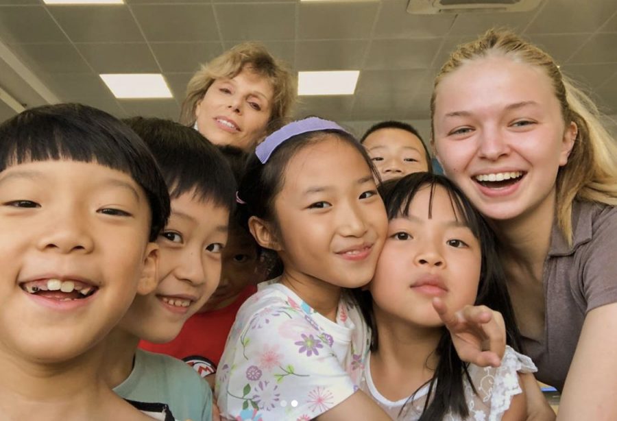 Senior Cara Spradling spent time with school children in Taizhou, Zhejiang. She is graduating early to explore other cultures and travel all over. 