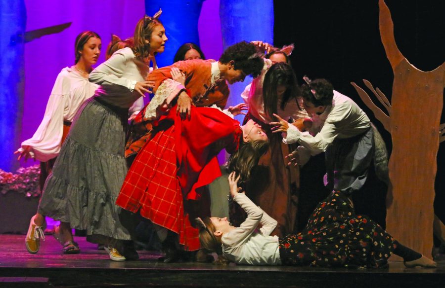 DANCING WITH THE BIG BAD WOLF: Junior Haley Pousson dances with Junior Jaden Davis and his entourage of wolves. Pousson played the role of Little Red Riding Hood, while Davis played The Big Bad Wolf. “Little Red is on a journey to bring bread and supplies to her grandmothers house in the woods,” Pousson said. 