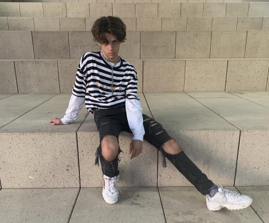 LOOKING SERIOUS: Junior Parker Swett poses on the steps in front of Austin City Hall. Swett has only recently started professionally modeling, but has liked having photos taken for years. 