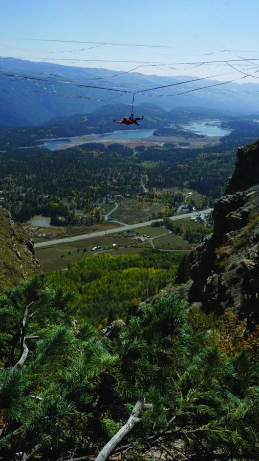 DANGLING HIGH: Smith dangles attached to a harness. Smith can slackline between mountain tops or over a body of water. 