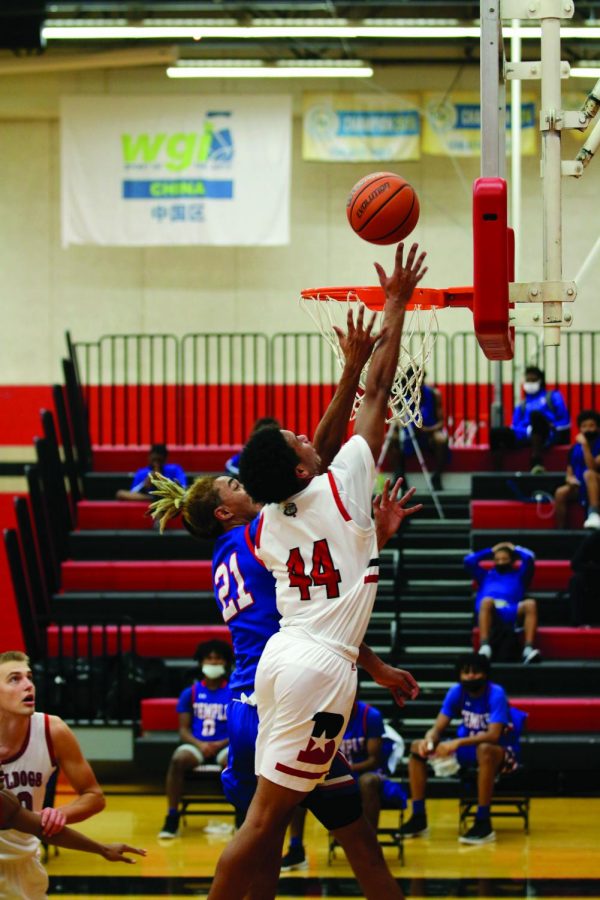 SHOOTING HIGH:  Senior LD Butler shoots a lay-up in the home game last week against Temple. This is Butler’s first season on the varsity roster’s starting line up. 