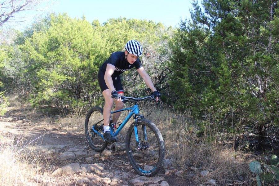 ROCKY ROAD: Liam Spencer practices mountain biking along the Violet Crown Trail in Austin. Spencer began mountain biking with the Bowie team in his freshman year. 