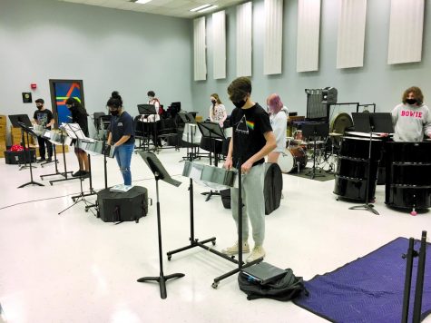 PRACTICING THE SONGS: Students in the steel drums class get together to practice playing their music. This was the first in-person rehearsals that was held and students were given the chance to either stay remote or practice in person. 