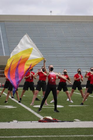 Swinging sabers and twirling flags each performance is just the basics for the Color Guard team. Color Guard students work to achieve the perfect routine, working with the band in the process. 
