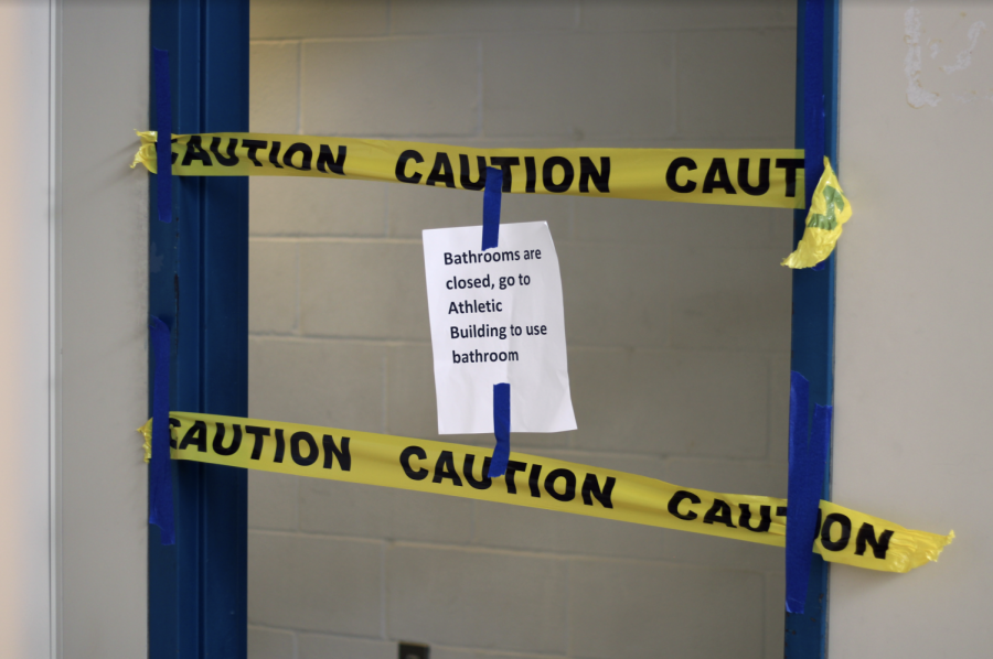 CLOSED OFF: All bathrooms in the main building are closed off with caution tape and signs. The only operating bathrooms are in the athletics building.