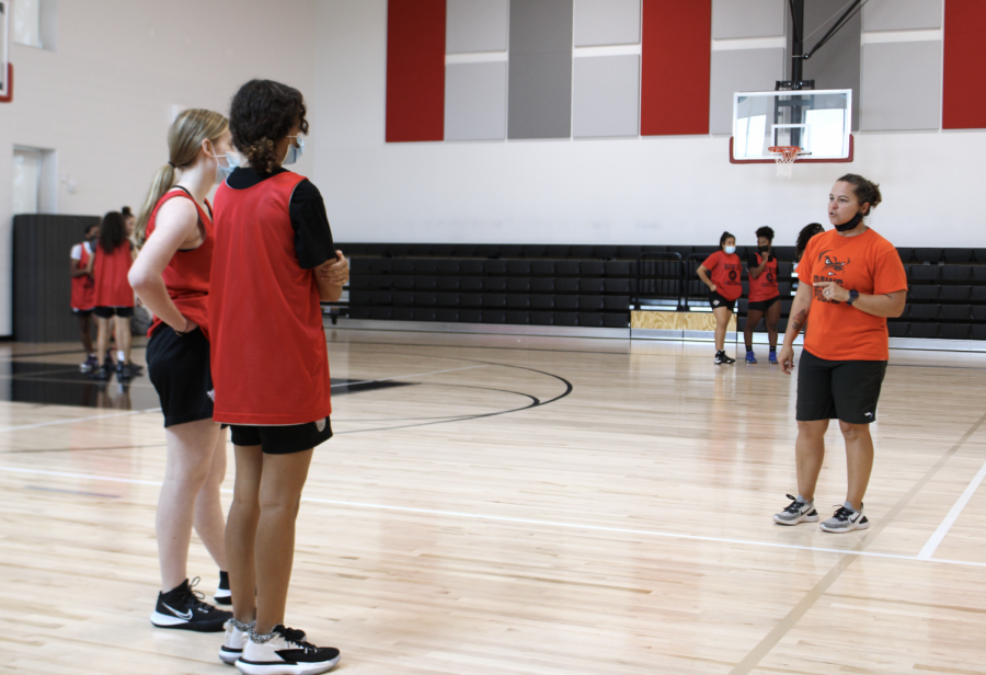 LISTENING TO AN EXPERT: During girls basketball practice, coach Lora Tilson gave advice to two different athletes. When preparing for the season, the team practices every day during school. 