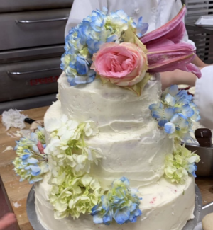 THREE, TWO, ONE BAKE: Culinary students bake three layer wedding cakes during class. After they were completed, chef Bugni voted to have at her wedding cake rehearsal. 