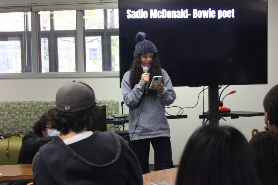 TALKING INTO THE MICROPHONE: Senior Sadie McDonald reads her own written poetry for students in honor of Black History Month. 
“I’m African American so I wanted to contribute by reading my own poem and share my experiences,” McDonald said. “I’m in Ms. Rolfe’s Creative Writing class so she encouraged me to read today.”
