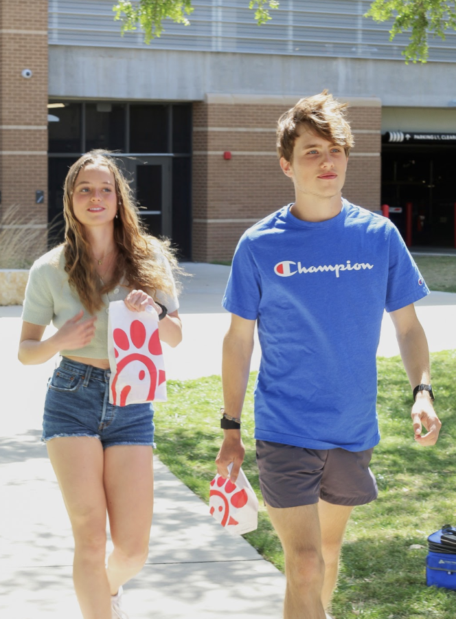 GRABBING+A+QUICK+LUNCH%3A+Seniors+April+Ikard+and+Zach+Kehler+return+to+Bowie+with+Chick-fil-A+in+hand.+The+nearest+Chick-fil-A+is+only+3.8+miles+away+from+Bowie.+