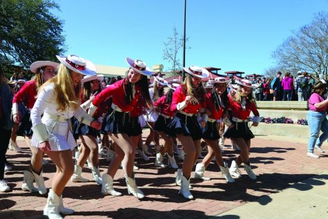 IN THEIR COWBOY BOOTS:  Silver Stars dance to Cotton Eye Joe in the pit. After Tyton Bensons performance in the courtyard, music played for students to dance to. “This event was especially important for Bowie this year as students are still adjusting to a “normal” school year post-pandemic,” Reese Gutshall said. “It is so important for our school to be unified as one, and lift each other up rather than drag each other down, especially after all that we have endured these past two years.”