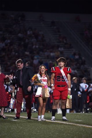 Max Barnes and Zoe Kanz celebrate after being crowned homecoming royalty.
