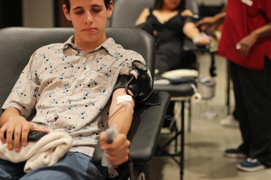 DONATING BLOOD: Junior Brant Kinzy waits as his blood is drawn during the drive. [I was] little bit nervous, Kinzy said. But I think overall, I was excited more than I was nervous.