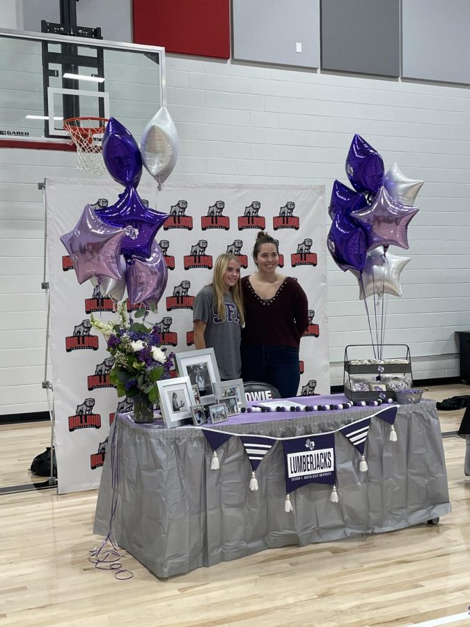 MAKING+IT+OFFICIAL%3A+Katie+Hansen+poses+with+coach+Madeline+Evans+during+signing+day.+Hansen+will+continue+her+volleyball+career+at+Stephen+F.+Austin+next+fall.