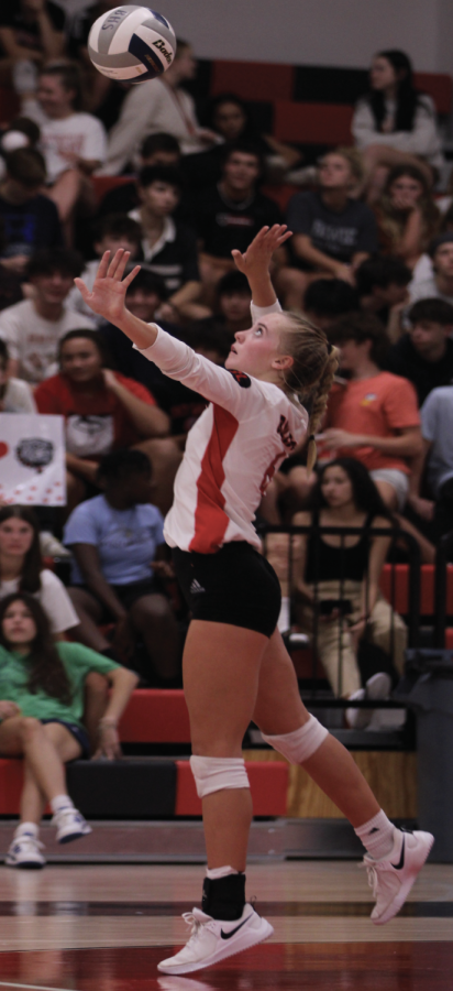 STRIKING A SERVE: Senior volleyball captain Katie Hansen prepares to volley a serve at the opposing team. Hansen was nominated for the All-district First Team as a junior.
