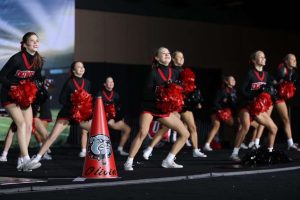CHEERING LOUD: The cheer team competes in the UIL State competition. Narrowly missing out on a spot in the finals, the team used their state performance to prepare for nationals in Orlando, Florida. 