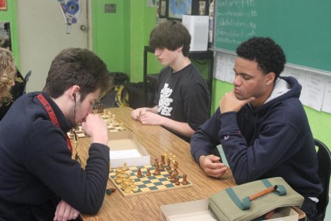 DURING CHESS CLUB: Senior Ashley Fuselier (left) junior Jody Louro (center) and junior Joaquin Welch (right) participate in games of chess.