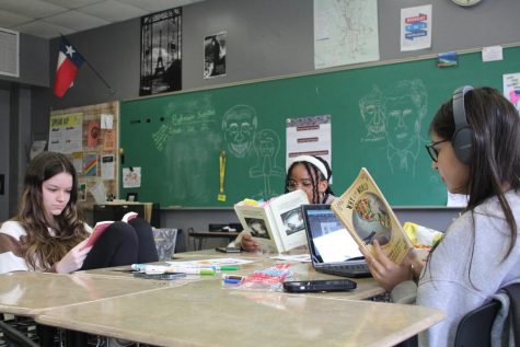 Sophomore Addie Hicks, Sara Hernandez and Olivia Walker read together in class.